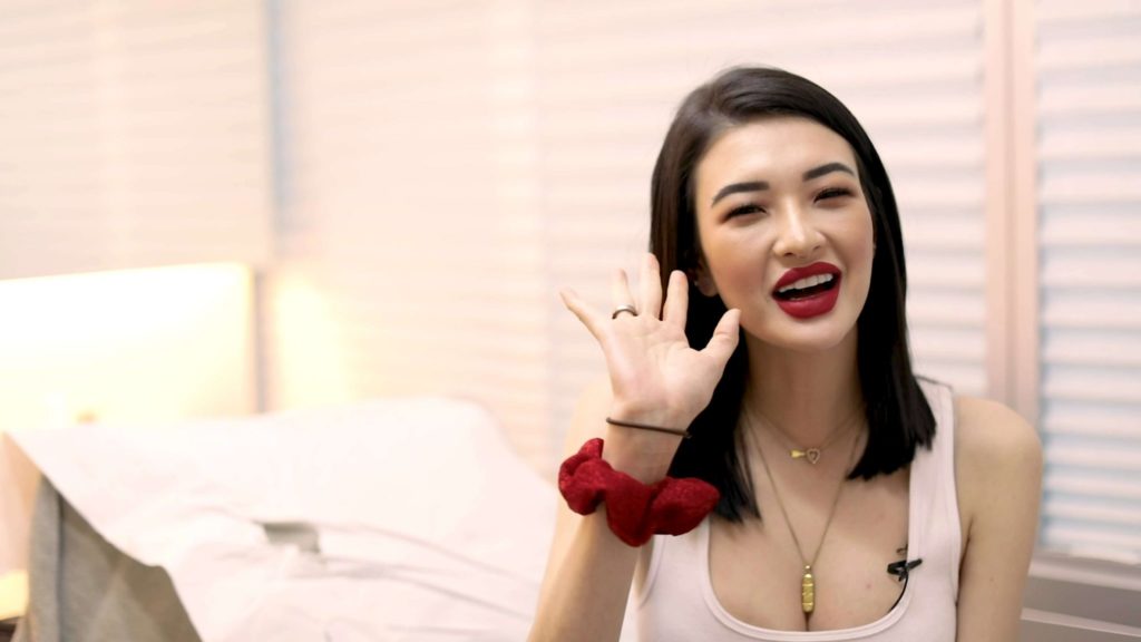 girl weaving her hand and smiling in a laser hair removal clinic